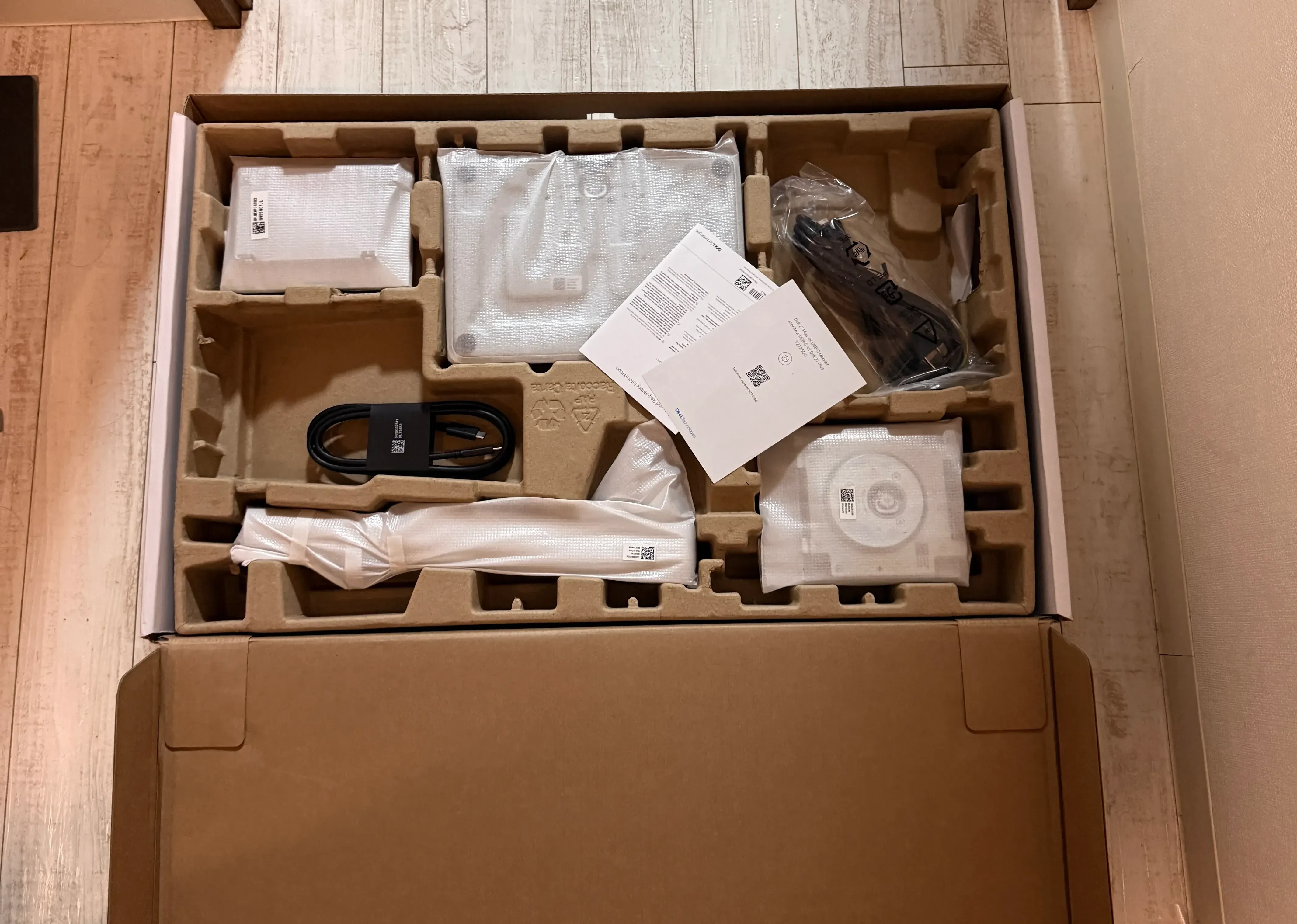 The unboxed contents. The accessories are laid out in an orderly fashion